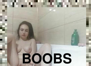 Young girlfriend with beautiful boobs masturbates in the bathroom