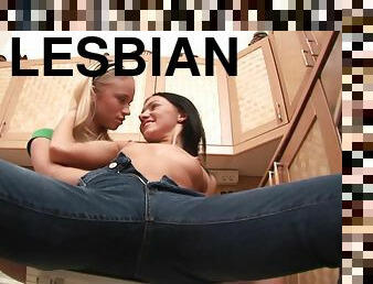 Beautiful brunette enjoys a lesbian sex on the kitchen's floor