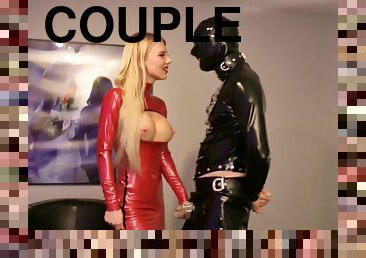 Lady Estelle in red latex plays BDSM games with her costumed friend