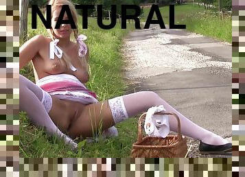 costumed Daphne Angel masturbates in nature using her fingers