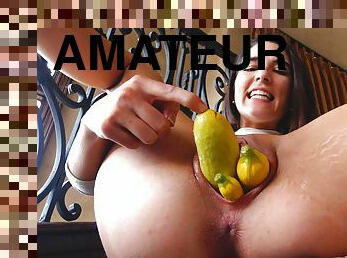 Brunette teen Miki spreads her pussy and stuffs it with vegetables
