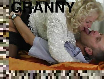 Blonde granny Shery surprises a young friend with a blowjob