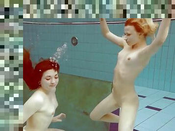 Two hot girls enjoy the pool naked