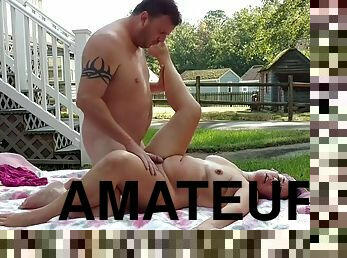 Amateur couple having passionate sex outdoors