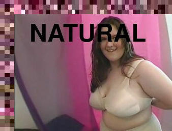 Big natural tits BBW stripteasing seductively displaying curves