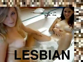 Two girls have fun in the bath together