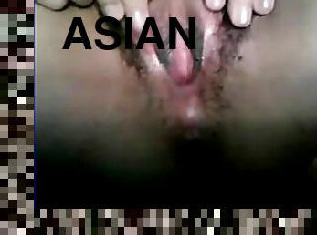 Asian teen strips off her underwear then masturbates