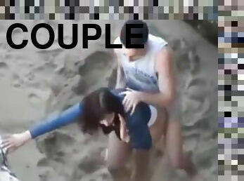 Hot young couple get caught fucking at the beach