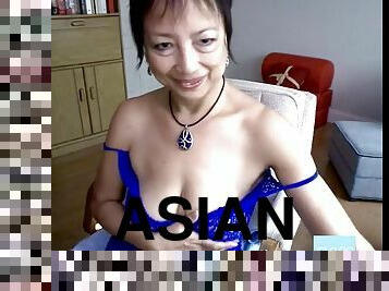 Horny Asian granny fucks herself with a dildo