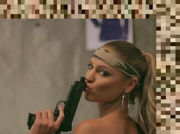 Centerold Charlie Riina looks good with guns and fake tits