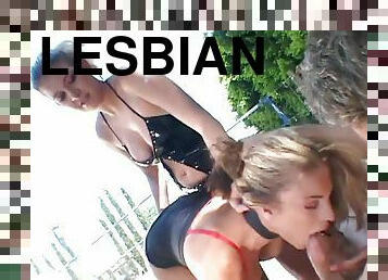 A guy fucks two sexy lesbians in fishnets outdoors