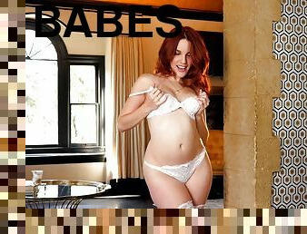 Redhead cuttie slips off her white lingerie to play around