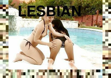 Having lesbian sex by the pool on a hot summer day