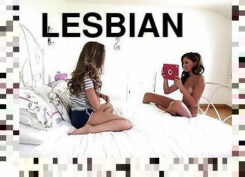 Two sexy girls make a red hot lesbian sex tape while in bed