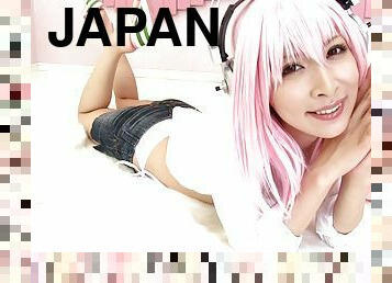 A pink haired Japanese babe in a bikini gets jizzed on