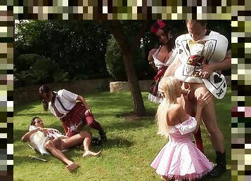 Hot outdoors group sex action along babes in parody outfits getting bonked