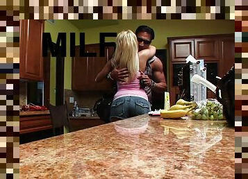 Curvy blonde milf getting slammed in the kitchen by two cocks