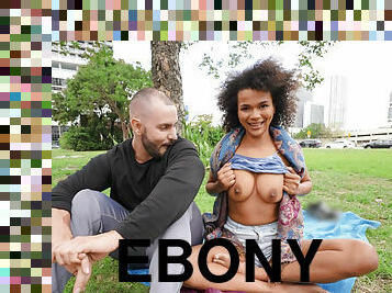 Nasty ebony vixen Alina Ali shows us her boobs sitting on the green grass
