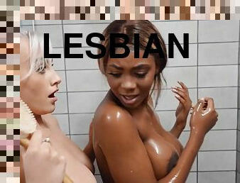 Interracial lesbian hotties lick and rub their naked bodies