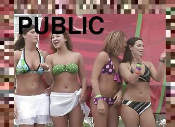 Some hot chicks in bikinis shake their butts in public