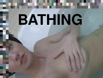 Magnificent girl loves masturbating in the bath