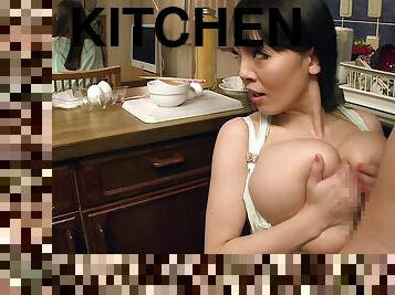 Perky Hitomi Tanaka sucking a cock next to a kitchen counter top