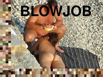 Blowjob on public beach