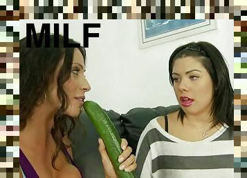 Latin MILF and teen sucking a cock in the living room