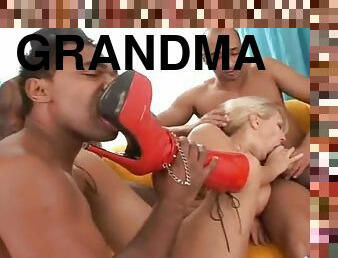 Wild blonde grandma enjoying black group sex here