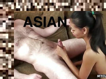 Ponny tail having asian brunette sucking a clean