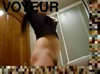 Voyeur Clip Of A brunette In the Bathroom