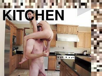 Petite teen blonde deepthroats and gets fucked hard in the kitchen