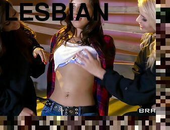 Corset wearing lesbian bitch fucks two girls with a strapon