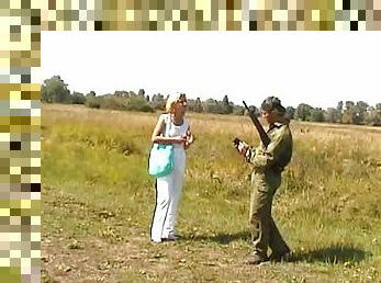 Hot blonde meets a soldier and fucks him in a field