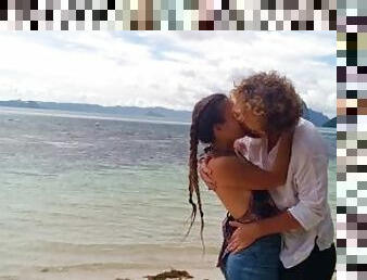 Hot couple in love passionately kissing on a remote tropical island