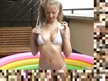 Pretty Blonde Teen Britney Rubs Her Clit In an Inflatable Pool