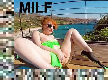 Horny redhead milf fucks herself in the pool