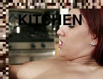Long-haired redhead Addison Ryder jumps on a shaft in the kitchen