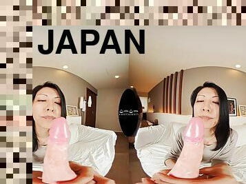 Japanese MILF sucking a VR dildo