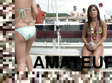 Bold bikini chicks on a boat take off their tops and flash titties