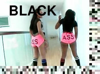 Two black asses in hot pink booty shorts