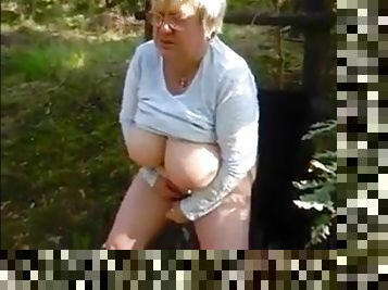 Breasted granny with glasses masturbating in the forest