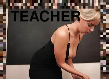 Teacher in a slinky black dress shows off her cleavage