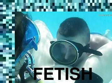 Eating pussy underwater with a scuba diving girl