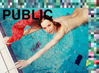 Adorable brunette teen swimming naked