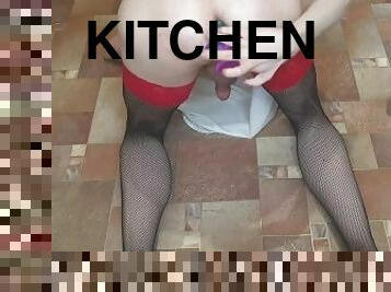 Crossdresser in the kitchen with dildo