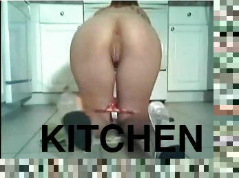 Showing her body on webcam in the kitchen