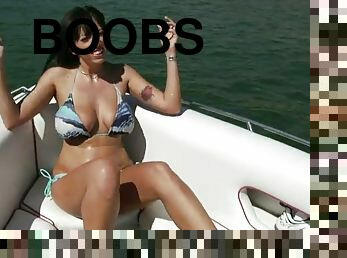 Slim brunette with big boobs gets fucked on a boat