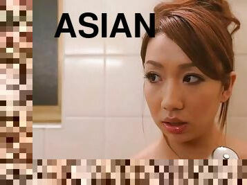 Asian milf sucks his cock and receives a big facial