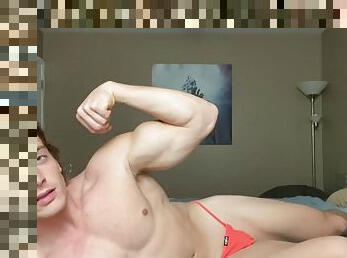 Small muscle showing off on the bed